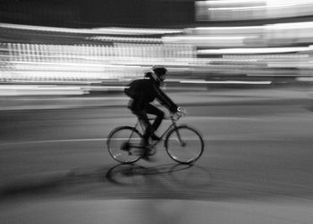 Man riding bicycle on road