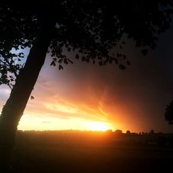 Scenic view of silhouette landscape against sky during sunset