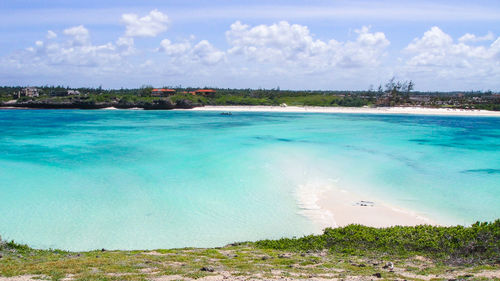 View of beach against cloudy sky