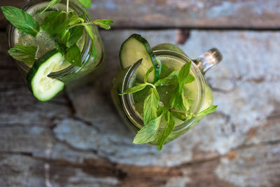 Directly above shot of smoothies in jar on table