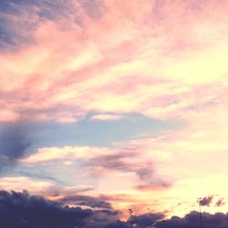 Low angle view of cloudy sky at sunset