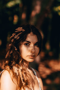 Portrait of beautiful young woman outdoors