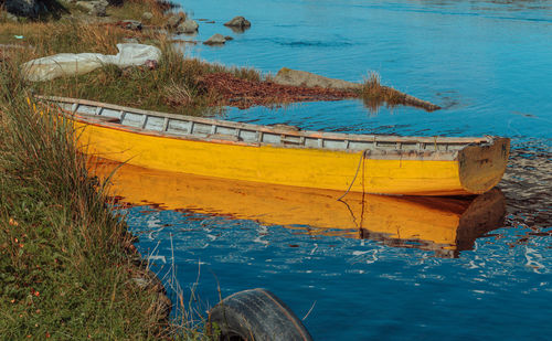 High angle view of abandoned boat moored in water