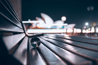 Close-up of illuminated bridge against sky in city