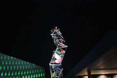 Low angle view of illuminated sky at night