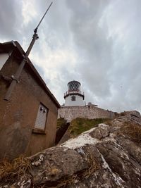 Low angle view of lighthouse against sky