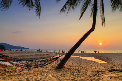 Scenic view of beach against sky during sunset