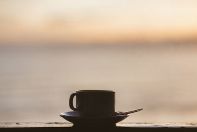 Close-up of coffee on table against sky