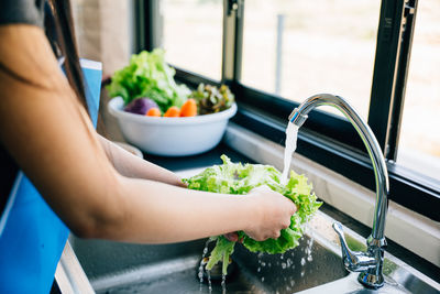 Midsection of woman preparing food