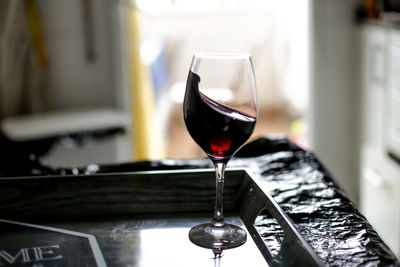 Close-up of wineglass on table