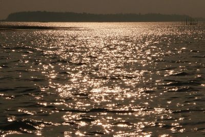 Scenic view of sea against sky at sunset