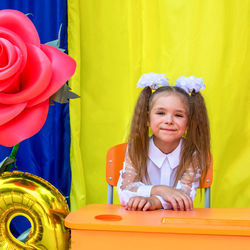 Girl with white bows during the celebration of the first of september.