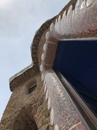 Low angle view of sculpture against sky