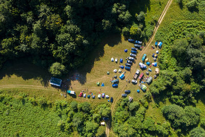 Aerial drone view of a camp with tents in the outdoors