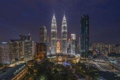 View of skyscrapers lit up at night