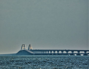 View of suspension bridge over sea