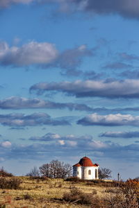 House on field against sky