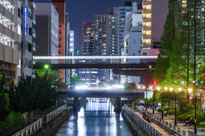 Illuminated buildings in city at night