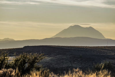 Scenic view of mountains against sky during sunset