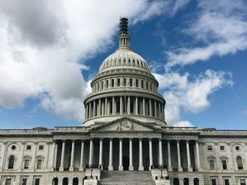 Low angle view of historic building against cloudy sky