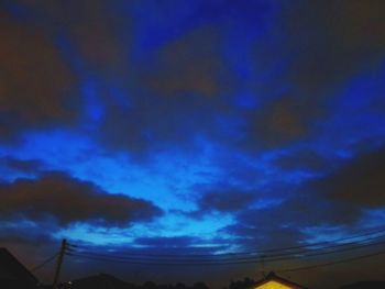 Low angle view of dramatic sky at night