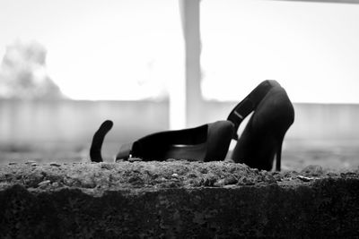 Close-up of shoes on land