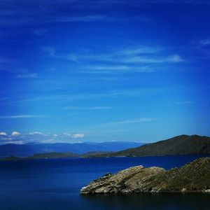 Scenic view of sea against blue sky