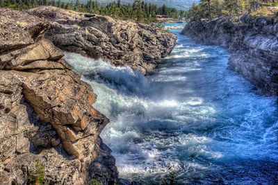 River flowing through rocks in forest