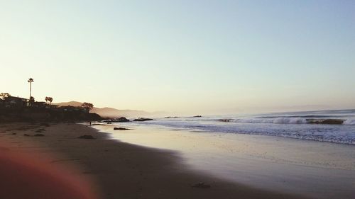 View of beach against clear sky