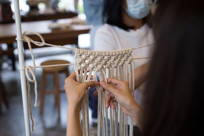 Women knitting crochets in workshop