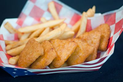 Close-up of french fries in paper plate