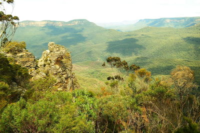 Scenic view of landscape and mountains against sky