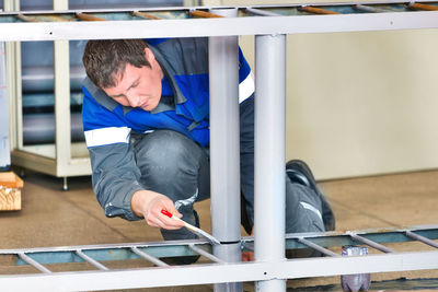 High angle view of boy playing in gym