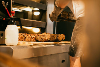 Midsection of man preparing food