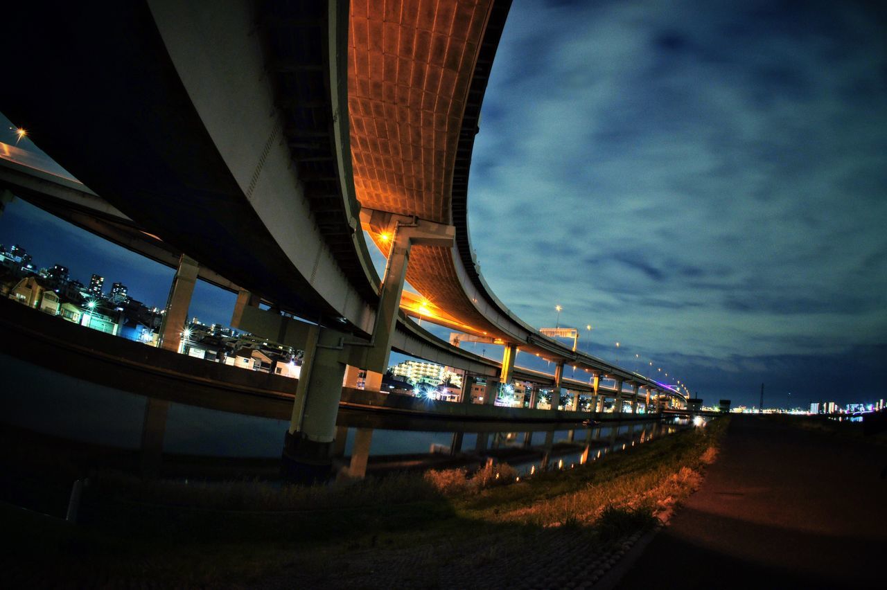 built structure, architecture, bridge - man made structure, illuminated, transportation, connection, night, engineering, sky, river, bridge, water, city, dusk, travel, suspension bridge, mode of transport, travel destinations, outdoors, cloud - sky