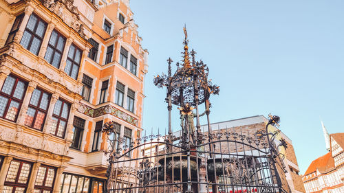 Low angle view of building against clear blue sky