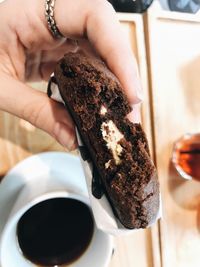 Midsection of woman holding coffee