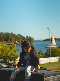 Full length of senior woman against clear sky