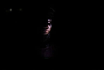 Woman looking away at night
