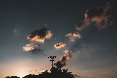 Low angle view of silhouette trees against sky during sunset