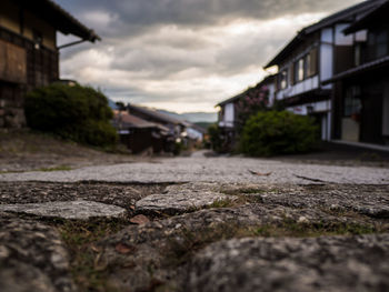 Surface level of street amidst buildings in city