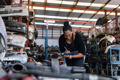 Female worker working in garage