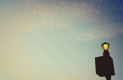 Low angle view of illuminated light against sky