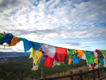 Low angle view of clothes drying on clothesline against sky