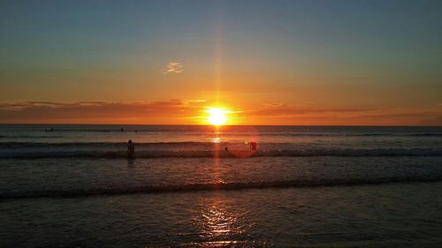 Scenic view of sea at sunset