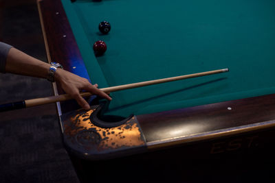High angle view of person playing pool