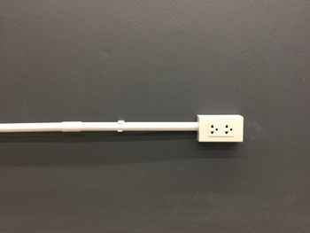 Close-up of electric lamp on wall