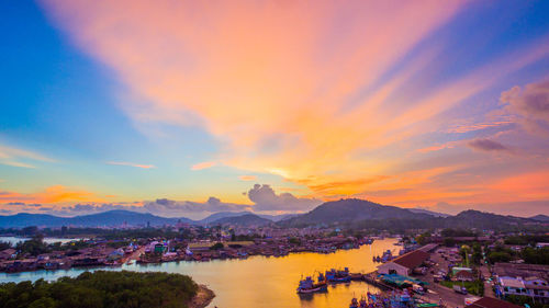 Panoramic shot of townscape against sky during sunset
