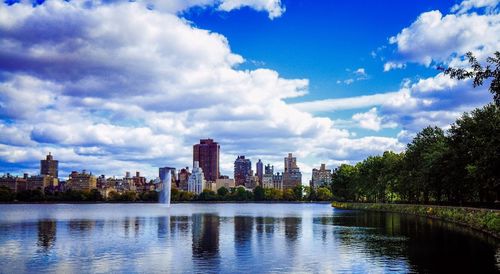 Cityscape against cloudy sky
