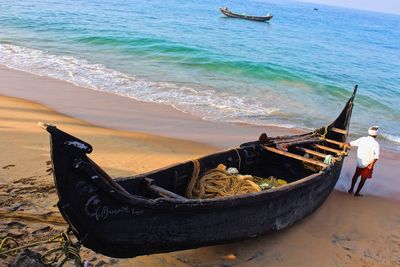 High angle view of abandoned boat moored on beach